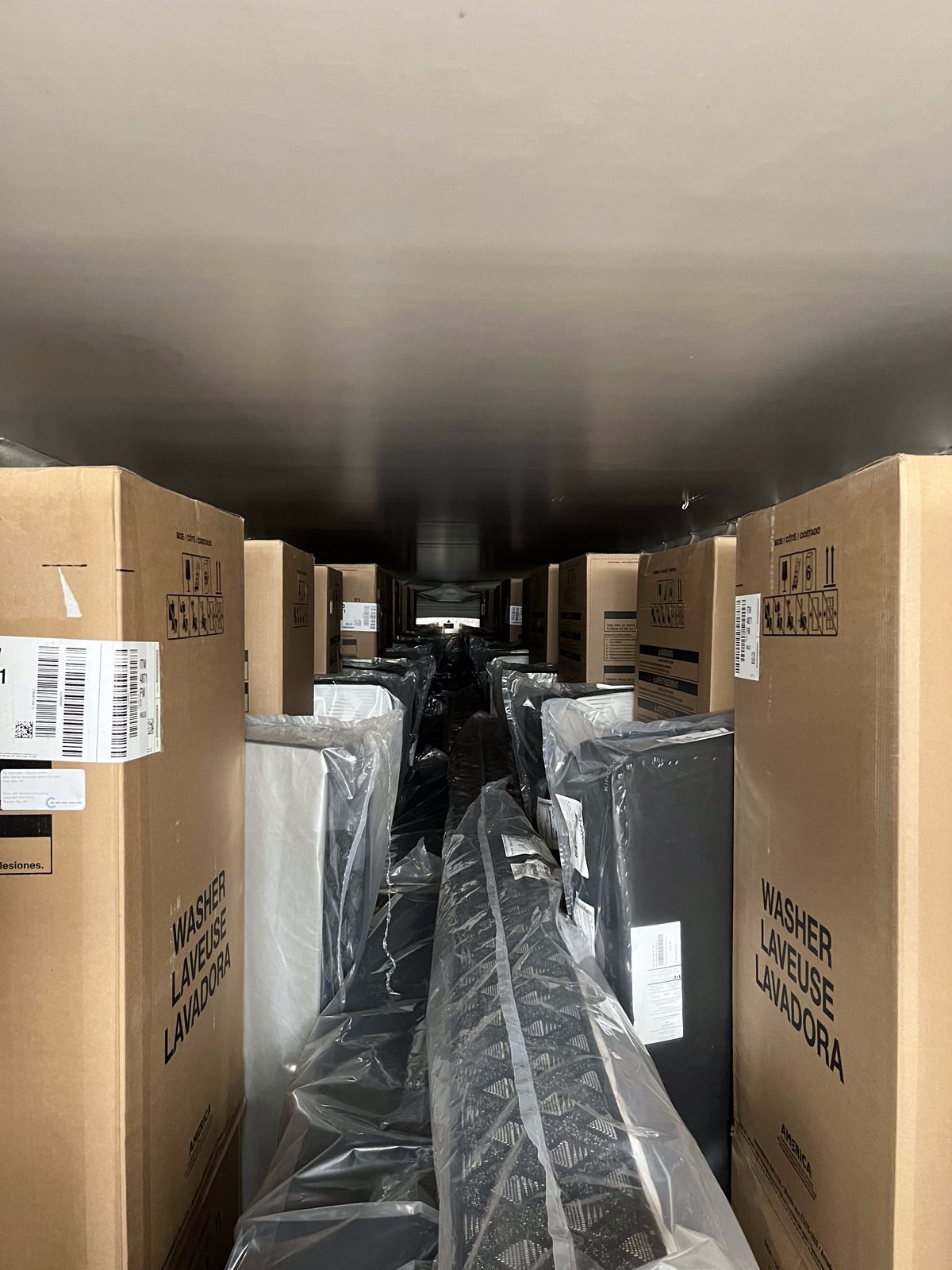 Boxed appliances loaded into a trailer