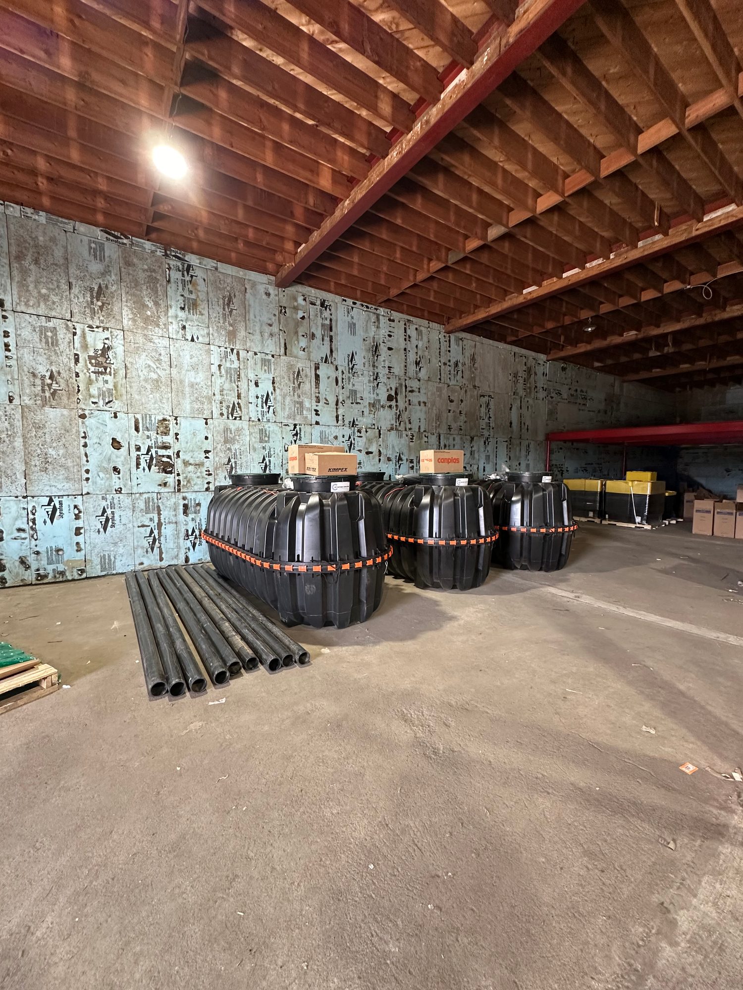 Septic tanks and pipe staged in the warehouse